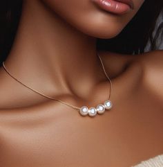 Our handmade pearl necklace, the epitome of timeless elegance and sophistication, perfect as a gift for a woman celebrating a birthday or as a cherished token for a bridesmaid. This exquisite necklace features lustrous pearls delicately strung together, creating a mesmerizing floating effect that exudes grace and beauty. Each pearl, a symbol of purity and wisdom, is meticulously selected for its flawless radiance, adding a touch of luxury to any ensemble. Whether she wears it with a casual outfi Classic Pearl Necklace With Pendant For Party, Classic Pearl Pendant Necklace For Party, Akoya Pearl Necklace With Pearl Pendant For Party, Akoya Pearl Pendant Necklace For Party, Elegant Pearl Charm Necklace For Birthday, Formal Pearl Necklaces For Mother's Day, Elegant Pearl White Necklace As Gift, Elegant Pearl Necklace For Birthdays, Elegant Gold Pearl Necklace For Birthday