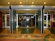 an entrance to a restaurant with glass doors that say, caution's one on the door