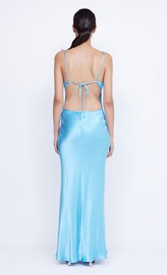 The elevated BEC + BRIDGE Margaux Keyhole Maxi Dress is crafted from a lustrous, topaz blue fabric in a flattering silhouette. The bias cut maxi dress features a v neckline, statement double keyhole cut-out detail and binding that travels and ties at the low cut, open back. Silk V-neck Maxi Dress With Back Opening, V-neck Satin Maxi Dress With Side Slits, Blue V-neck Maxi Dress With Side Slits, Gala Satin Maxi Dress With Bias Cut, Silk Maxi Dress For Prom, Blue Satin V-neck Dress For Party, Satin Maxi Backless Cocktail Dress, Cocktail Satin Backless Maxi Dress, Satin Backless Maxi Dress For Cocktail