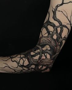 a person with a tree tattoo on their arm