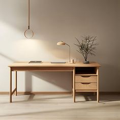 a wooden desk with a lamp on it next to a plant in a vase and an empty wall