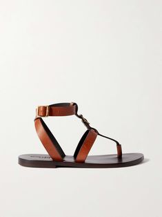 Designer Brown Sandals With Buckle Closure, Designer Open Toe Slingback Sandals With Buckle, Designer Open Toe Slingback Sandals With Buckle Closure, Calf Leather Sandals With Buckle Closure And Round Toe, Calf Leather Sandals With Heel And Toe Straps, Chic Leather T-strap Sandals With Round Toe, Designer Sandals With Leather Footbed And Single Toe Strap, Luxury Sandals With Buckle Closure For Vacation, Calf Leather Sandals With Buckle Closure And Open Heel