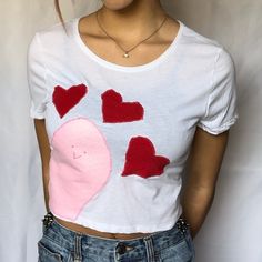 This super cute, lightweight, unique Baby Tee is perfect for everyday outfits! Design is hand-sewn onto a blank top by me. If you're looking for a fun and unique top, this shirt is perfect for you! Only 1 available! 💗Free 3 day US shipping  💗Handmade & One of a kind 💗52% cotton + 48% polyester  Sizing: Height: 17.5"    Chest: 17" CARE INSTRUCTIONS: Wash inside out, machine wash warm, tumble dry low, medium iron.  💗You may also like💗 Halleys comet baby tee: https://www.etsy.com/listing/13263 Cute Fitted T-shirt With Heart Graphic, Fitted Pink T-shirt With Heart Graphic, Summer Cotton T-shirt With Heart Print, White Cotton T-shirt With Heart Patch, Fitted Patchwork T-shirt For Spring, Cute Cropped Cotton T-shirt, Cotton Graphic Tee With Patchwork, Cotton Patchwork Graphic Tee T-shirt, Fitted Casual T-shirt With Heart Graphic