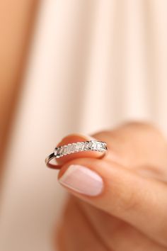 Diamond, which is the hardest material in the world formed centuries ago, has turned into a symbol showing the infinity and value of love over the years. We carefully design these jewels that you will wear as a symbol of the eternity of your love. 🔻Diamond ring will look amazing on your lover's finger! 🔻Engagement rings will bring luck to your new family! 🔻Promise Ring will connect lovers forever! 🔶 Total Carat: 0.17CT 🔶 Stone Pieces: 13 🔶 Main Stones Measurement: 0.17CT - 2.00X1.10MM 🔶 Gold Carat: 14 K  🔶Silver 925 💌 Zircon Stone 📌Zircon is a stone that strengthens the mind and memory. 📌It opens the closed chakras of people and revitalizes the aura. 📌It provides easy sleep. It helps to keep people away from bad dreams and nightmares. 📌It has a healing effect on emotional fluc Baguette Cut Diamond Promise Ring, Baguette Cut Diamond Promise Ring Jewelry, Cubic Zirconia Stackable Rings For Anniversary, Elegant White Gold Crystal Half Eternity Ring, Emerald Cut Cubic Zirconia Half Eternity Ring, Cubic Zirconia Emerald Cut Half Eternity Ring, Diamond Baguette Promise Ring Jewelry, Dainty White Gold Ring With Baguette Diamonds, Dainty Baguette Diamond Jewelry For Anniversary