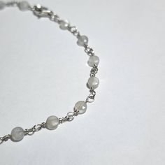 Sterling Silver hand beaded link bracelet. Faceted White Moonstone 4mm coin shape beads with a spring ring clasp. This stunning simple dainty bracelet has a nice sparkle that flashes as it reflects light with its tiny facets. Perfect for a bride, bridesmaid or as i do, everyday wear.  This bracelet as it is is 6 inches but id be happy to adjust it to your wrist at no extra charge up to 8 inches.  Contact me to customize the fit.  All orders will be given tracking numbers so you can track your order.  Shipped within 48 hours Silver Round Moonstone Crystal Bracelet, Silver Moonstone Round Crystal Bracelet, Silver Moonstone Crystal Bracelet, Minimalist Hypoallergenic Beaded Round Bracelets, Minimalist Hypoallergenic Round Beaded Bracelets, Minimalist Hypoallergenic Beaded Bracelet, Silver Dainty Crystal Bracelet With Gemstone Beads, Everyday Round Moonstone Bracelets, Everyday Moonstone Bracelets