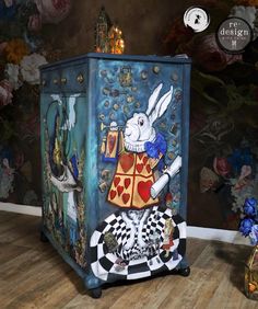 an artisticly painted cabinet in the shape of a rabbit