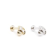 Elevate your cartilage jewelry collection with an elegant diamond stud earring. Crafted from 14k solid gold, this modern and minimalist design features two prong-set diamonds totaling 0.025 carats. Chic and comfortable, it's the perfect accessory for adding a touch of sophistication to your everyday style. The threaded screw pin earring post is easy to insert and remove, and the flat back makes it comfortable to wear. Our screw pin flat back earring studs are made of solid 14k gold and are hypoa Gold Helix Earrings, Diamond Piercing, Daith Jewelry, Helix Jewelry, Earring Cartilage, Tragus Jewelry, Cartilage Jewelry, Gold Diamond Studs, Labret Studs