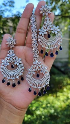 ●Fast Same Day Ship From New York city.  ●Comes with Nice Jewelry Box. ●Premium Rhodium Finished Products.  ●We Maintain American Standard Quality.  ● Over 1000+ repeated customers served on Instagram @sheandcraft Handmade Unique Chandler-type large Chandbali  Gorgeous Earrings with Matching Mang Tikka Set,  Many colors available like .. Featuring with Shappire Blue (Dark) Hydro Crystal Stone, Crystal Clear American Diamond CZ Stone, Which are mixed Pear cut Marquise cut sparkly diamond look Sto Luxury Tilla Earrings For Festivals, Dark Blue Jewelry Set, Luxury Chandelier Earrings With Latkans For Reception, Luxury Bridal Chandbali Earrings With Matching Set, Luxury Chandbali Tikka For Diwali, Luxury Chandelier Earrings With Latkans, Luxury Chandbali Tikka For Festive Occasions, Luxury Hand Set Chandbali Tikka, Luxury Festive Chandelier Earrings With Latkans