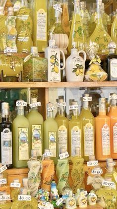 many different types of bottles on display in a store