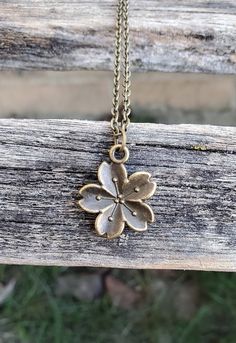 "This cute Sakura flower (cherry blossom) necklace would make a great gift! The flower and chain are an antique bronze color and measures 3/4\". You can choose the length of your necklace at checkout. This would make a great gift for a bridesmaid or a birthday, an anniversary or Christmas. All jewelry items come in a gift box." Cute Sakura Flower, Sakura Necklace, Cute Sakura, Flower Cherry Blossom, Cherry Blossom Necklace, Gift For Wedding, Memory Locket, Sakura Flower, Locket Necklace