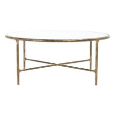 an oval glass table with gold metal frame