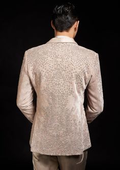 Our basilica tuxedo is a fusion of three types of embroideries. The fabric has been created with an all over geometric linear embroidery. Its has a metallic embroidery over it which is further highlighted with crystals and metallic beads. Fitted Silk Sherwani For Reception, Sequined Fitted Party Sherwani, Elegant Formal Sequined Sets, Elegant Formal Sequin Sets, Elegant Formal Sets With Sequins, Formal Fitted Silk Sherwani, Fitted Silk Sherwani For Formal Occasions, Festive Elegant Sherwani With Sequins, Embellished Fitted Bandhgala For Party