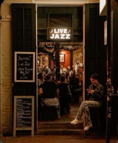 people sitting in front of a jazz bar