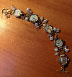 "FUN! This is a bracelet made from vintage watches dating from the 1930s and up. There are a variety of watches used; this one includes Helzberg 10k RGP, Benrus 10k RGP, Devon 10k RGP and Bulova 10k RGP. I just love the different shapes of the watches! I've used faux pearls and clear crystals in this bracelet.  The bracelet measures about 1/2\" wide and 7.25\" long but can be shortened or lengthened to your specifications, simply send me a message. Each of my pieces are one of a kind, unique pie Jewelry Made From Old Watches, Luxury Vintage Handmade Watch Accessories, Vintage Bracelet Watch, Cool Watches Unique, Repurposed Watches, Button Choker, Victorian Steampunk Wedding, Watch Bracelets, Watch Art