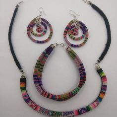 Handmade Set Of Earrings And Bracelet With Collected Blanket That Is Used By Peruvian Artisans From The City Of Cusco. These Earrings Are Made By Hand From Peruvian Blanket Fabric. Circle-Shaped Ethnic Earrings Multicolored Handwoven Bohemian Jewelry, Colorful Handwoven Bohemian Jewelry, Colorful Bohemian Handwoven Jewelry, Adjustable Multicolor Fair Trade Earrings, Handmade Adjustable Red Jewelry Sets, Adjustable Handmade Red Jewelry Sets, Handmade Colorful Bracelet Jewelry, Handmade Colorful Jewelry Bracelet, Handmade Colorful Bracelet