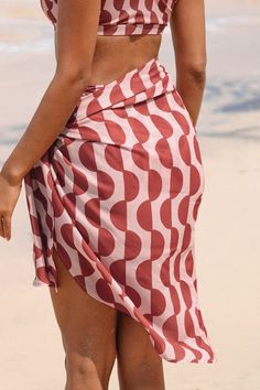 Add a touch of tropical charm to your beach look with our Coral GEO Knotted Sarong. Crafted with vibrant coral hues and featuring a stylish knotted design, it effortlessly elevates your seaside ensemble. Product code: CAA07D4D007JD Features:  Woven Knotted Midi Material: 100%POLYESTER. Beachy Sarong For Poolside Spring, Summer Sarong For Beach And Resort Season, Summer Beach Sarong For Resort Season, Casual Beach Cover-up With Tie-side Bottom, Casual Tie-side Bottom Beach Cover-up, Casual Sarong For Beach Season Vacation, Knotted Swimwear For Beach Season, Beachy Sarong For Vacation, Beachy Sarong For Vacation Beach Season