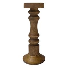 a tall wooden candle holder on a white background