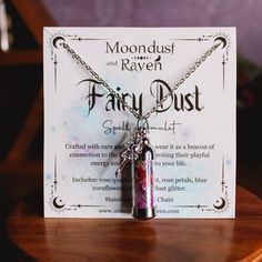 Our Fairy Dust Spell Jar Amulet Necklace contains a powerful blend of rose quartz, amethyst, rose petals, blue cornflowers, and fairy dust glitter, each chosen for their mystical properties. It is accompanied by a silver fairy charm. Handcrafted with care and intention, this unique piece serves as a beacon of connection to the fairy realm. Stainless Steel 20 inch chain. Vial is 1.5" in length.  If you would like the spell jar necklace without the charm, or would like a different charm, message u Purple Fantasy Necklace For Gift, Purple Fairycore Jewelry For Gifts, Fairycore Purple Jewelry As A Gift, Fairycore Purple Necklace For Gift, Fantasy Style Purple Necklace For Gift, Magical Silver Crystal Necklace For Gift, Silver Fantasy Crystal Necklace Gift, Silver Crystal Necklace For Gift In Fantasy Style, Silver Crystal Necklace For Gift With Magical Style