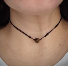 Choker Tiger eye bead -8 mm *this necklace is made for you to stand out from others and can be combined with your charms or crystals *1mm nylon cord *Waterproof *color: black/red/beige/brown/green/light blue/white/vine red/purple/blue Estimated shipping times United States: 3-5 weeks North America: 3-5 weeks Europe: 9-18 business days I'll do my best to meet these shipping estimates, but cannot guarantee them. Spiritual Brown Choker As Gift, Spiritual Brown Choker Gift, Brown Adjustable Choker As A Gift, Brown Adjustable Choker For Gift, Brown Adjustable Length Choker As Gift, Adjustable Length Brown Choker As Gift, Pet Collar Charms, Tiger Eye Gemstone, Clip On Charms