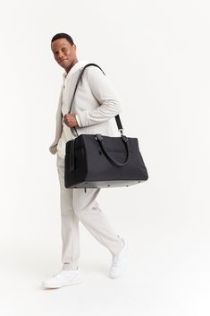 BÉIS 'The Commuter Duffle' In Black - Black Duffle Bag & Overnight Bag Black Leather Trim Duffle Bag For On-the-go, Black Duffle Bag With Leather Trim In Tote Shape, Black Leather Trim Duffle Bag Tote, Black Duffle Bag With Leather Trim, Modern Weekender Bag With Leather Handles For On-the-go, Modern Bags With Leather Trim For Business Trips, Modern Gym Bag With Luggage Sleeve For On-the-go, Functional Duffle Bag With Luggage Sleeve For On-the-go, Functional Black Travel Bag With Leather Trim