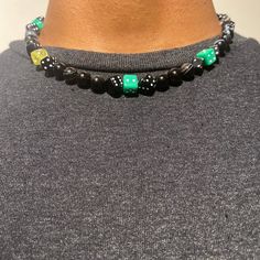 “The Buttercup”. Green And Black Dice Beaded Choker Made With Obsidian Crystal Beads. Steel Dice Beads Added For Flair. All Pieces Are Handmade! Casual Black Beaded Necklace With Colorful Beads, Black Necklaces With Round Letter Beads, Casual Black Bead Jewelry For Festivals, Green Casual Beads For Festival, Casual Wooden Beads For Festival, Casual Black Necklace For Streetwear, Black Beaded Necklace With Letter Beads, Black Beaded Necklace With Letter And Round Beads, Handmade Black Jewelry For Streetwear