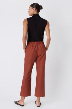 Fall calls for ease with our elastic waist Brit Crop Pant. With a mid-rise fit, angle seam pockets and the perfect leg opening, this style is a breeze to wear in the cooler weather. Pair it with your favorite ankle boot or sneaker, this style is designed for women on the go.THIS ITEM IS FINAL SALE. 1.5" front waistband, elastic at sides and back, angle seams with front pockets, midrise, easy fit, clean finish hem. - 51% Cotton, 49% Nylon - Fabric Woven in Italy - Made in NYC - Professional dry c Fall Pants With Elastic Waistband And 5-inch Inseam, Fall Ankle-length Pants With Seam Detailing, Relaxed Fit Ankle-length Pants With Button Closure, Relaxed Fit Orange Ankle-length Pants, Stretch Ankle-length Pants With Seam Detailing, Perfect Legs, Cooler Weather, Cropped Pants, Mid Rise