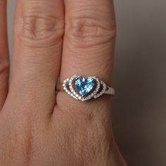 This is a gorgeous handmade creation. Its beauty is its simplicity & Elegance. The 6*6 mm heart cut faceted real Swiss Blue Topaz is crafted in solid sterling silver and with rhodium plated. All item is sent in a beautiful gift box If you have any idea of design your ring,pls contact me directly. You can realize more lovely stuff clicking the link https://www.etsy.com/shop/knightjewelry?refshopsection_shophome_leftnav Please leave the correct address and you phone number for delivering succe Blue Heart Cut Ring For Gift, Blue Topaz Heart Cut Promise Ring, Silver Heart Cut Topaz Ring Gift, Gift Topaz Ring With Accent Stones, Heart Cut, Heart-shaped Topaz Ring For Gift, Heart Wedding Rings, Swiss Blue Topaz Ring, Swiss Blue Topaz, Wedding Rings Unique