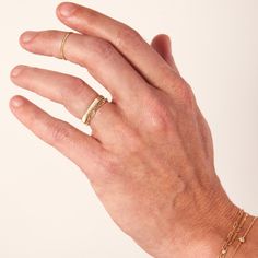 A shiny and shimmering coin-edged ring to wear on its own, or to add to a stack. Throw a coin in the metaphorical fountain! Timeless Gold Stackable Initial Ring, Fine Jewelry Stackable Initial Ring With Round Band, Stackable Initial Ring With Round Band In Fine Jewelry, Everyday Stackable Yellow Gold Signet Ring, Stackable Yellow Gold Signet Ring For Everyday, Gold Stackable Signet Ring In Recycled Gold, Gold Minimalist Stackable Engraved Ring, Gold Signet Ring With Thick Band Stackable, Gold Signet Ring Stackable With Thick Band