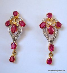 14k GOLD EARRINGS EAR STUD FROM RAJASTHAN INDIA, GREAT HANDMADE DESIGN MADE OF 14K YELLOW GOLD SATED REAL A QUALITY RUBY & DIAMOND GEM STONES, NICE PIECE GOOD FOR JEWELRY COLLECTION.Height max. - 2.8 cm(1.1")width max. - 1.2 cm(0.47")Total weight - 3 gramsMaterial - 14 carat solid yellow gold & real gem stones. Ruby Gemstone Diamond Earrings In Fine Jewelry Style, Ruby Diamond Earrings In Fine Jewelry Style, Fine Jewelry Ruby Diamond Earrings, Ruby Diamond Earrings Fine Jewelry, Yellow Gold Ruby Earrings With Diamond Accents, Diamond Gemstone Earrings In Temple Jewelry Style, Diamond Gemstone Temple Jewelry Earrings, Temple Jewelry Diamond Gemstone Earrings, Temple Style Diamond Gemstone Earrings