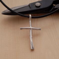 A minimalist sterling silver cross pendant necklace for men that shows his commitment to Lord while making the perfect accent for his hand-tailored suit. What makes it most unique, is that it has a primeval vibrancy that is dramatically striking. Ideal to wear every day, it looks great with everything and might just become your signature staple accessory. Give the gift of love and light with this original City Lights Jewellery creation. Order now to guarantee availability. Cross measures 4cm x 2 Minimalist Handmade Cross Jewelry, Minimalist Sterling Silver Cross Necklace, Simple Sterling Silver Cross Pendant Necklace, Simple Sterling Silver Cross Pendant Jewelry, Simple Sterling Silver Cross Pendant, Minimalist Handmade Cross Necklace, Modern Crucifix Cross Necklace As Gift, Modern Sterling Silver Cross Pendant, Modern Sterling Silver Cross Pendant Jewelry