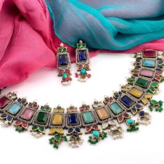 This beautiful necklace features a matte golden finish and a combination of colorful stones and CZ. Perfect for any occasion, this stunning necklace is sure to be admired. Available in multiple color choices: - Multicolor / Rainbow - Ruby Red - Emerald Green Luxury Statement Emerald Necklaces, Luxury Multicolor Emerald Gemstone Necklace, Luxury Emerald Kundan Necklace For Festivals, Rainbow Ruby, Multicolor Necklace, Colorful Stones, Round Rock, Cz Necklace, Stunning Necklace