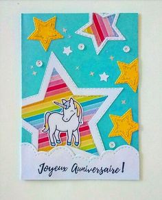 a card with an unicorn and stars on it