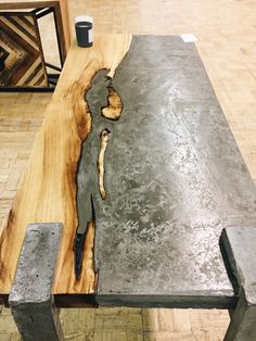 the table is made out of metal and wood