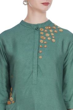 For a traditional look at work, pick this green silk blend tunic. It features 3D flower motif embroidery. Team it up with gold-toned pants to complete the look. 
Mandarin collar
Utility pockets
Three quarter sleeves - Aza Fashions Green Slub Silk Straight Kurta Dress, Festive Green Kurta With Floral Embroidery, Designer Long Sleeve Kurta With Yoke, Green Straight Kurta With Embroidered Neckline, Green Straight Kurta Dress With Embroidered Neckline, Green Embroidered Neckline Straight Kurta Dress, Green Blouse Piece With Resham Embroidery For Transitional Seasons, Green Straight Kurta Sets With Embroidered Neckline, Green Straight Kurta With Floral Embroidery