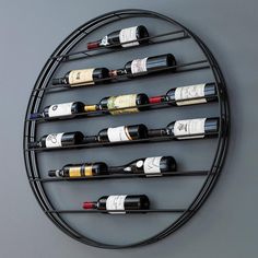 a circular metal wine rack holding several bottles