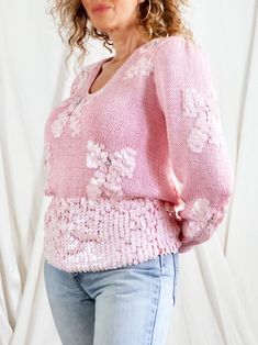 Vintage 80's sweater. Entirely handknit in the dreamiest shade of bubblegum pink. Embellished details of bows, made out of shimmery, opalescent sequins with a sparkling crystal, heart center. Deep, v-neckline. Long sleeves with ribbing at wrist. Lightly padded puff shoulder. Wide waistband can be worn scrunched up or let down. ---------------------------- details circa | 1980's material | acrylic blend + sequins + crystals ---------------------------- measurements size | no tag fits like | mediu Pink Balloon Sleeve Sweater For Winter, Pink Sweater For Winter Party, Pink Winter Party Sweater, Feminine Pink V-neck Sweater, Fitted Spring Sweater With Sequins, Spring Fitted Sweater With Sequins, Pink Sweater For Fall Party, Pink Fall Party Sweater, Pink V-neck Top With Sequins