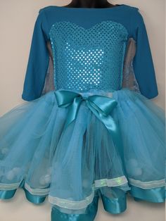 Adorable Three piece Elsa/Frozen party outfit for Birthday, Halloween, playtime or dress up! Super cute sparkly Shirt or Bodysuit with attached snowflake cape and fluffy Tutu. Please message me  size and/or color choices. Holiday Princess Tutu Dress For Dress-up, Fitted Christmas Tutu Dress For Fancy Dress, Fitted Tutu Dress For Christmas Fancy Dress, Festive Princess Tutu Dress With Sequins, Princess Tutu Dress For Party Season, Playful Sequin Party Dresses, Playful Sequined Party Dress, Playful Party Dress With Sequins, Long Sleeve Winter Party Costumes