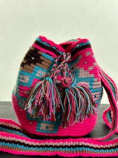 𝐖𝐡𝐚𝐭 𝐚𝐫𝐞 𝐖𝐚𝐲𝐮𝐮 𝐁𝐚𝐠𝐬? Wayuu bags are handwoven by the Wayuu people, an Indigenous community from the La Guajira region in northern Colombia. These bags, known as "mochilas," are made using traditional weaving techniques passed down through generations. The intricate weaving process can take several weeks for each bag, making them unique pieces of art that reflect the craftsmanship and cultural heritage of the Wayuu tribe. Our Wayuu bags are uniquely embellished by our artisans, ad Wayuu Bag, Indigenous Community, Traditional Weaving, Weaving Process, Handmade Bag, Bag Handmade, Cultural Heritage, Weaving Techniques, Bag Women