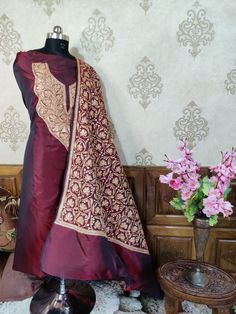 Pure Silk Tilla Kashmiri Suit With Heavy Embroidered On Dupatta, This Kashmiri Premium Tilla Salwar Suits Comes in Three-Piece; Shirt , Salwar and Dupatta and is Available in Both Unstitched as well as Stitched Options. Embroidery Tilla Embroidery Suit Type Three-Piece (Shirt, Dupatta and Salwar) Color Maroon Fabric Pure Raw Silk Free Shipping Yes About Tilla Embroidery : Tilla embroidery is one of the most celebrated Kashmiri handicrafts, where the silver, golden or copper hues of tilla (zari) Designer Anarkali Set With Embroidered Border, Traditional Anarkali Set With Dupatta For Eid, Festive Chanderi Anarkali Set With Embroidered Border, Navratri Embroidered Anarkali Set With Traditional Drape, Dola Silk Anarkali Set With Embroidered Border, Transitional Resham Embroidered Art Silk Anarkali Set, Embroidered Anarkali Set For Navratri With Traditional Drape, Festive Silk Anarkali Set With Embroidered Border, Navratri Anarkali Set With Embroidered Traditional Drape