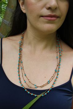 "Super-cute minimalist layered necklace - one is natural braided waxed cotton cord with turquoise faceted beads. The second necklace is long and hand-knotted with tiny, precious sterling silver beads. You have dual looks - wear the long necklace long for a dramatic effect, or doubled for a layered look. Details for both necklaces: * Handmade * Necklace lengths: 22\" and * Closure: * Style: Bohemian, beachy, summery" Everyday Handmade Multi-strand Jewelry, Bohemian Jewelry With Tiny Beads For Layering, Adjustable Multi-strand Hand Wrapped Necklaces, Adjustable Hand Wrapped Necklaces For Layering, Adjustable Multi-strand Turquoise Necklace Gift, Handmade Turquoise Jewelry With Waxed Cord, Adjustable Hand-strung Necklaces For Layering, Adjustable Multi-strand Beaded Necklace For Everyday, Adjustable Necklace For Layering