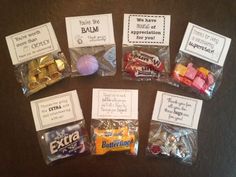 several candy bags with different types of candies in them on top of a table