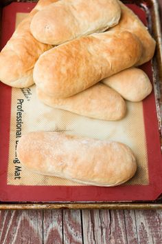 bread rolls sitting on top of a red tray