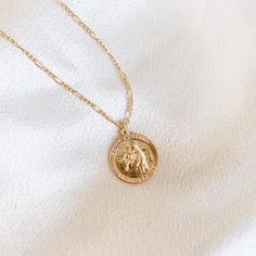 Handcrafted • Waterproof • Tarnish resistant 14k gold filled Saint Anthony coin on a 14k gold filled Figaro Chain. Unisex and available in 2 lengths. 14k Gold Filled Medallion Charm Necklace, Tarnish Resistant, Tarnish Resistant 14k Gold Filled Medallion Charm Necklace, Gold Medallion Coin Necklace With Figaro Chain, Gold Plated Coin Necklace With Figaro Chain For Gift, Gold-filled Coin Necklace Gift, Tarnish Resistant, Round Coin Necklace With Figaro Chain As Gift, Round Coin Necklace With Figaro Chain For Gift, Gift 14k Gold Filled Coin Necklace, Tarnish Resistant, 14k Gold Filled Tarnish Resistant Coin Necklace Gift