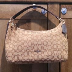 **Like New** $325 Coach East/West Celeste Convertible Hobo / Crossbody Bag Purse! Features: - Color: Brown Outline Signature Canvas - Interior Zip Pocket, 2 Slide Pocket - Gold-Tone Hardware - Double-Zip Closure - Coach Key Fob Still Attached - Approx. 14 1/4" (L) X 8 1/4" (H) X 5" (W) - Looks To Be In Nwot Condition, No Signs Of Wear! Note, Selling At A Discounted Price Since The Bag Is Missing The Convertible Crossbody Strap. Add Your Own Strap! Still Functional, Cute, And A Great Option To Ge Beige Shoulder Bag With Handle Drop In Coated Canvas, Elegant Brown Coated Canvas Hobo Bag, Classic Coach Beige Hobo Bag, Coach Beige Double Handle Hobo Bag, Coach Beige Hobo Bag With Detachable Strap, Coach Beige Hobo Bag For Travel, Gold Shoulder Bag With Leather Handles And Coated Canvas, Coach Beige Satchel Hobo Bag, Coach Beige Shoulder Bag With Handle Drop