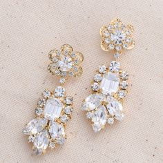 Meet our stunning LALE Earrings with Swarovski crystals. Featuring round and marquise shaped Swarovski crystals creating a unique design and a gorgeous pair of earrings! The LALE Earrings are a daintier version of our CEMILE earrings!. Our LALE Earrings are a perfect pair to add the right amount of sparkle to your look on your special day! The shine on these earrings is impeccable. Handcrafted with the Highest Quality Materials Swarovski Crystals Platinum plated - Guards against scratches and ta Sparkling Dazzling Crystal Earrings, Dazzling Bridal Earrings With Sparkling Stones, Dazzling Crystal Earrings With Sparkling Stones, Dazzling Crystal Diamond Earrings, Dazzling Crystal Diamond Earrings With Sparkling Stones, Sparkling Crystal Earrings, Crystal Cluster Drop Earrings With Sparkling Stones, Dazzling Crystal Embellished Cubic Zirconia Earrings, Crystal Embellished Dangle Earrings