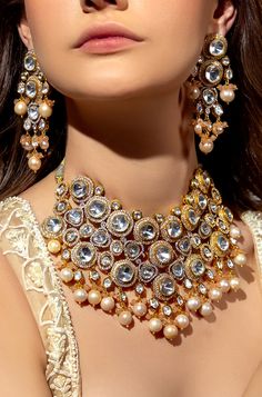 Baroque Pearl & Polki Necklace Set - Joules By Radhika Capture hearts on your wedding day with our 22KT Gold Plated necklace set. The enchanting Hydro Polkis, exquisite baroque pearls, and alluring Agate Beads unite in perfect harmony. This captivating ensemble complements your bridal charm, radiating sophistication and grace. SET INCLUDES: Necklace and Earrings Details: Handcrafted with ❤️ Metal: Brass Product Type: Choker Stone: Hydro Polkis, baroque pearls, Agate Beads Plating: 22K Gold Plati Bridal Jewellery Online, Polki Necklace Set, Indian Bridal Jewelry, Indian Bride Outfits, Bride Outfits, Polki Necklace, Bridal Jewellery Indian, Gold Necklace Set, Bride Clothes