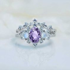 clio-https://clio.giliarto.com/ring/1/766-7x5 Purple Engagement Ring Silver, Purple Rings Engagement, Lavender Engagement Ring, Gold Floral Engagement Ring, Purple Wedding Rings, Purple Engagement Rings, Dream Proposal, Pretty Engagement Rings, Floral Engagement Ring