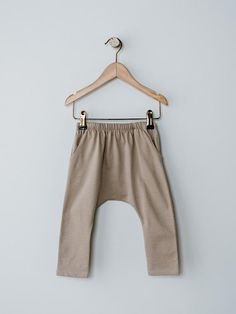 Comfort and style come together perfectly in this playtime favorite. Featuring a dropped crotch, harem silhouette, and hidden drawstring in the waistband, this trouser is made with our luxuriously soft organic cotton. Pair it with any of our cozy basics like The Boxy Tee or our Short Sleeve Pocket Onesie. Reshape whils Essential Sweater, Harem Trousers, Gray Label, Toddler Tops, Boxy Tee, Knitted Romper, Organic Fabrics, Swimwear Sale, Come Together