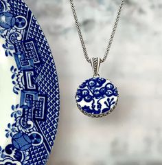 "Beautiful and timeless! Broken china jewelry is a lovely traditional china gift to celebrate your 20th wedding anniversary with your wife. She will love her handmade jewelry carved from vintage china and set in sterling silver! Our broken china necklace features a beautiful tree from the iconic blue and white pattern on the classic Blue Willow design. Unique vintage blue willow china, sterling silver filigree setting. ( 7/8\" round, lightly antiqued) Includes our favorite 16\" popcorn style ste 20th Wedding Anniversary, Blue Willow China, Beach Floral, Blue And White Pattern, Broken China Jewelry, Ceramic Heart, Ceramic Necklace, Horse Jewelry, China Jewelry