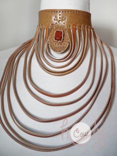 Unleash your bohemian soul with this beautiful one off unique large handmade leather choker necklace with red jasper gemstone. Red Jasper is a stone of empowerment. This necklace is made from the finest quality leather which is hand punched with a tribal design. This is not only a necklace it is a piece of art. Approximate Dimensions: Length 23cm Width 21cm This large leather choker necklace is adjustable at the back so it fits all sizes. Available in a wide range of colors. The product is new a Adjustable Leather Jewelry For Jewelry Making, Unique Handmade Leather Jewelry, Handmade Adjustable Leather Jewelry, Bohemian Leather Jewelry, Elegant Leather Jewelry For Festivals, Artisan Leather Jewelry, Adjustable Boho Collar Jewelry As Gift, Unique Adjustable Choker With Variations, Unique Adjustable Natural Color Jewelry